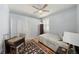 Cozy bedroom with hardwood floors and a desk area at 8507 Portage Ave, Tampa, FL 33647