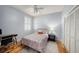 Cozy bedroom with hardwood floors, built-in closet, and a workspace at 8507 Portage Ave, Tampa, FL 33647