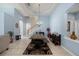 Elegant dining room with a farmhouse table and access to the kitchen at 8507 Portage Ave, Tampa, FL 33647