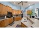 Well-equipped kitchen with wood cabinets and stainless steel appliances at 8507 Portage Ave, Tampa, FL 33647