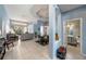 Open floor plan with tile floors, a half bathroom and views into Gathering room at 8507 Portage Ave, Tampa, FL 33647