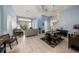 Bright and airy living area with a view into the kitchen and dining area at 8507 Portage Ave, Tampa, FL 33647