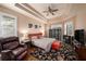 Main bedroom with hardwood floors, a cozy seating area, and lots of natural light at 8507 Portage Ave, Tampa, FL 33647