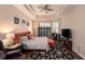 Main bedroom with hardwood floors, a cozy seating area, and lots of natural light at 8507 Portage Ave, Tampa, FL 33647