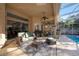 Relaxing poolside patio with seating area and screened enclosure at 8507 Portage Ave, Tampa, FL 33647