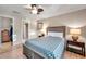 Bedroom with wood bed frame and ensuite bathroom access at 5218 Beach Se Dr # D, St Petersburg, FL 33705