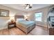 Guest bedroom with a wood bed frame and a large window at 5218 Beach Se Dr # D, St Petersburg, FL 33705