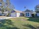 Charming one-story house with well-maintained lawn at 1027 Hardwood Dr, Valrico, FL 33596