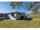 Spacious backyard with mature trees and partially fenced at 10273 109Th Ave, Largo, FL 33773