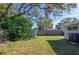 Large backyard with mature trees and a storage shed at 10273 109Th Ave, Largo, FL 33773