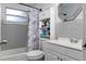 Clean bathroom with a shower/tub combo and storage at 10273 109Th Ave, Largo, FL 33773
