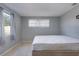 Simple bedroom with a queen-size bed and neutral decor at 10273 109Th Ave, Largo, FL 33773