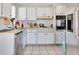 Bright kitchen with white cabinets and stainless steel appliances at 10273 109Th Ave, Largo, FL 33773