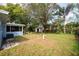 Spacious backyard with mature landscaping and a shed at 10545 110Th Ave, Largo, FL 33773