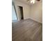 Bedroom with wood-look floors and closet at 1116 Carmona Ave, Spring Hill, FL 34608