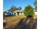 House front with a yard and landscaping at 1116 Carmona Ave, Spring Hill, FL 34608