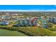 Aerial view of waterfront condo building with pool and tennis courts at 11730 Shipwatch Dr # 503, Largo, FL 33774