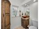 Elegant bathroom with ornate vanity, copper sink, and decorative cabinetry at 119 8Th E St, Tierra Verde, FL 33715