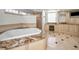 Spa-like bathroom with soaking tub and walk-in shower at 119 8Th E St, Tierra Verde, FL 33715