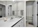 Clean bathroom with a single sink vanity, shower, and plenty of storage at 119 8Th E St, Tierra Verde, FL 33715
