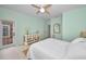 Light and airy bedroom with light green walls and patio access at 119 8Th E St, Tierra Verde, FL 33715