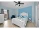 Serene bedroom with light blue walls and a white bed at 119 8Th E St, Tierra Verde, FL 33715