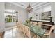 Bright dining room with glass-top table and buffet at 119 8Th E St, Tierra Verde, FL 33715