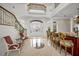 Two-story entryway with a breakfast bar and sitting area at 119 8Th E St, Tierra Verde, FL 33715