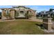 Large two-story home with a grand entrance and manicured lawn at 119 8Th E St, Tierra Verde, FL 33715