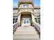 Impressive entryway with grand staircase and double doors at 119 8Th E St, Tierra Verde, FL 33715