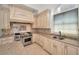 Modern kitchen with custom cabinetry and high-end appliances at 119 8Th E St, Tierra Verde, FL 33715
