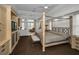 Spacious main bedroom with large bed and built-in media center at 119 8Th E St, Tierra Verde, FL 33715