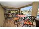 Enjoy meals al fresco at this patio table and chair set at 119 8Th E St, Tierra Verde, FL 33715