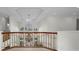Open upper landing with gold railing overlooking the grand foyer at 119 8Th E St, Tierra Verde, FL 33715