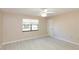 Spacious bedroom with light flooring and a window providing natural light at 12609 Shadow Ridge Blvd, Hudson, FL 34669