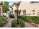 Landscaped walkway leading to the side entrance of the home at 1339 Lahara Way, Trinity, FL 34655