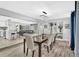 Elegant dining room with a dark wood table and crystal chandelier at 1384 S Hillcrest Ave, Clearwater, FL 33756