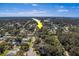 Aerial view showcasing the property's setting within a quiet residential neighborhood at 1638 St Catherine W Dr, Dunedin, FL 34698