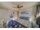 Relaxing bedroom with ceiling fan and nautical decor at 1638 St Catherine W Dr, Dunedin, FL 34698