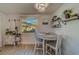 Charming dining area with a round table and two chairs at 1638 St Catherine W Dr, Dunedin, FL 34698