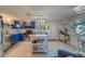 Modern kitchen with blue cabinets, stainless steel appliances, and an island at 1638 St Catherine W Dr, Dunedin, FL 34698