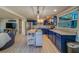 Updated kitchen featuring blue cabinetry, stainless steel appliances, and an island at 1638 St Catherine W Dr, Dunedin, FL 34698