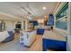 Bright kitchen boasts blue cabinets, stainless steel appliances, and an island at 1638 St Catherine W Dr, Dunedin, FL 34698