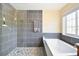 Bathroom with walk-in shower and soaking tub at 18136 Sandy Pointe Dr, Tampa, FL 33647