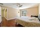 Main bedroom with hardwood floors, ceiling fan and private deck access at 18136 Sandy Pointe Dr, Tampa, FL 33647