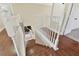 White railing staircase leading to an upper level at 18136 Sandy Pointe Dr, Tampa, FL 33647