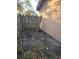 Small backyard with dirt and leaves. Needs landscaping at 1816 45Th S St, St Petersburg, FL 33711