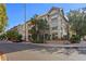 Building exterior showcasing a Mediterranean style with palm trees and a street view at 2440 W Horatio St # 1030, Tampa, FL 33609