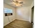 Neat bedroom with laminate floors, natural light, a ceiling fan, and closet at 3211 S Ferdinand Ave, Tampa, FL 33629