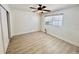 Cozy bedroom featuring a ceiling fan, a window with blinds, and a closet space at 3211 S Ferdinand Ave, Tampa, FL 33629